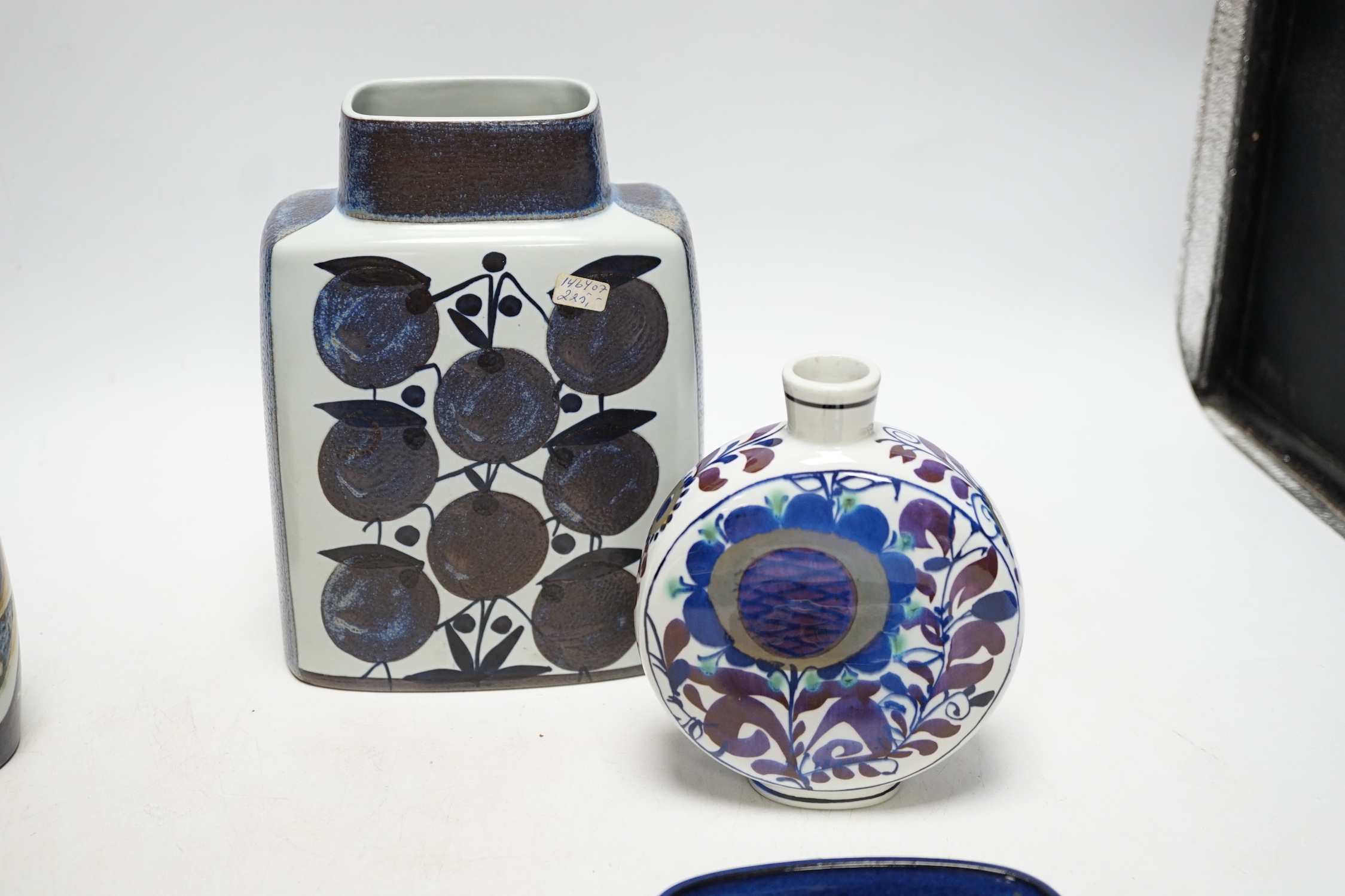 A Royal Copenhagen rectangular section fajance vase and a smaller similar bird decorated vase a circular floral vase and two varying sized square dishes, tallest vase 19cm high